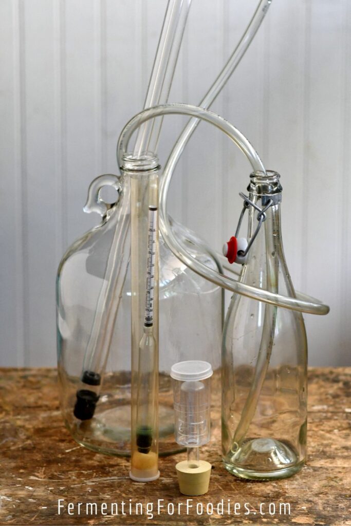 Carboy, auto-siphon, bottle, airlock and hydrometer