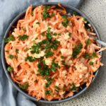 How to make a carrot apple salad with creamy horseradish dressing.