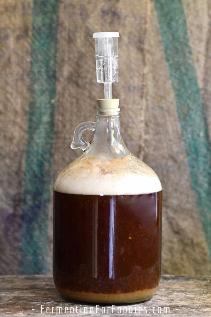 Beer in a carboy with an airlock.