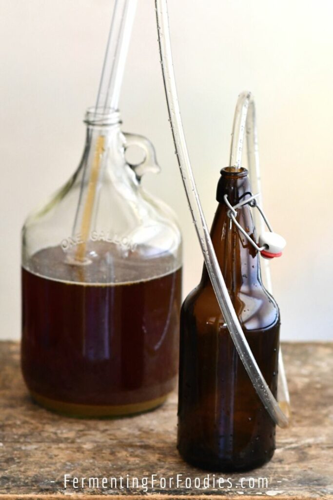 Carboy with an auto-siphon in a beer bottle.