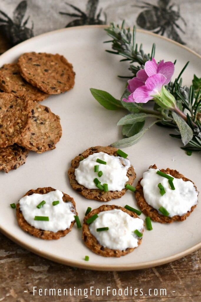 Kefir cheese on crackers with chives