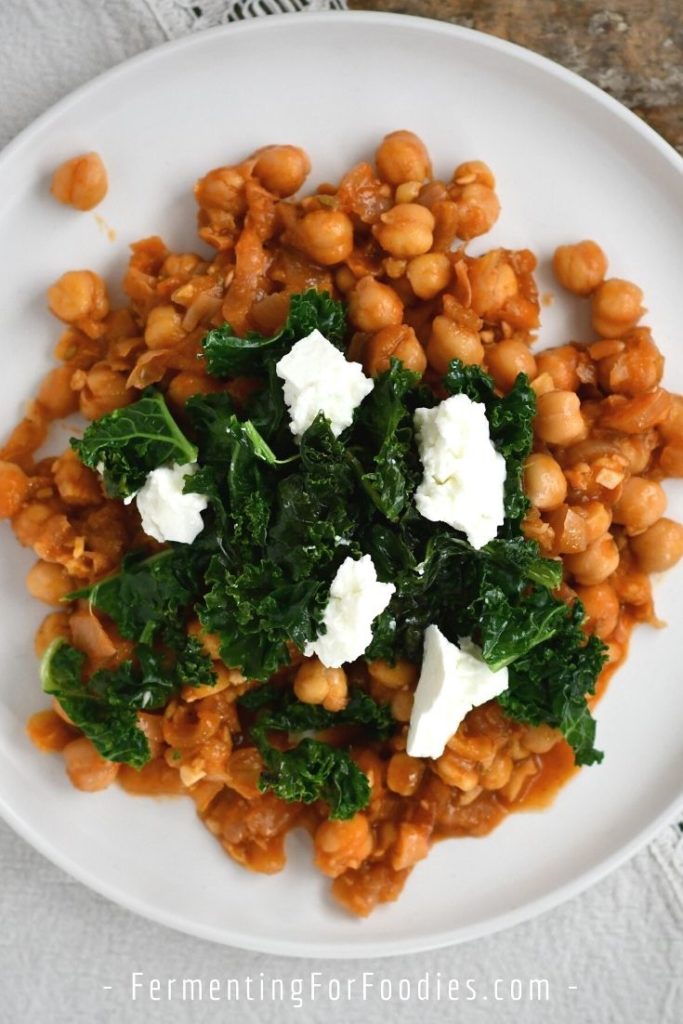 Turkish chickpea stew with kale and eggs as a healthy breakfast or brunch