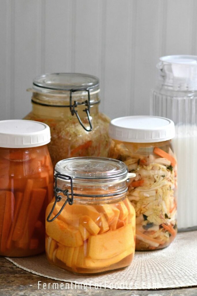 Jars of fermented vegetables and dairy