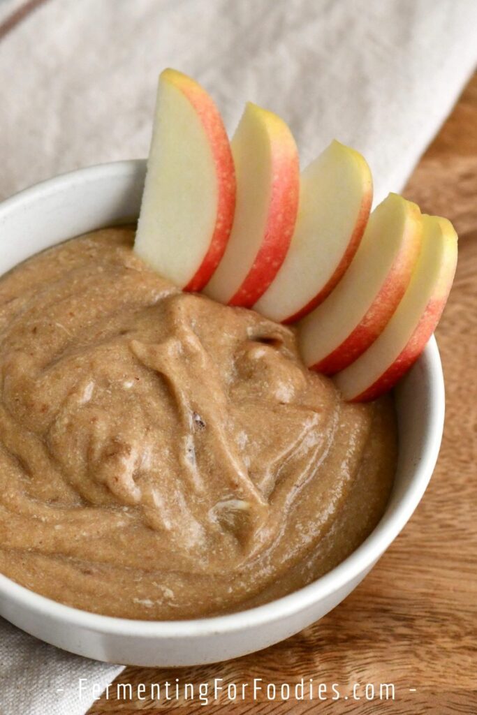 Coconut date sauce with apple slices.